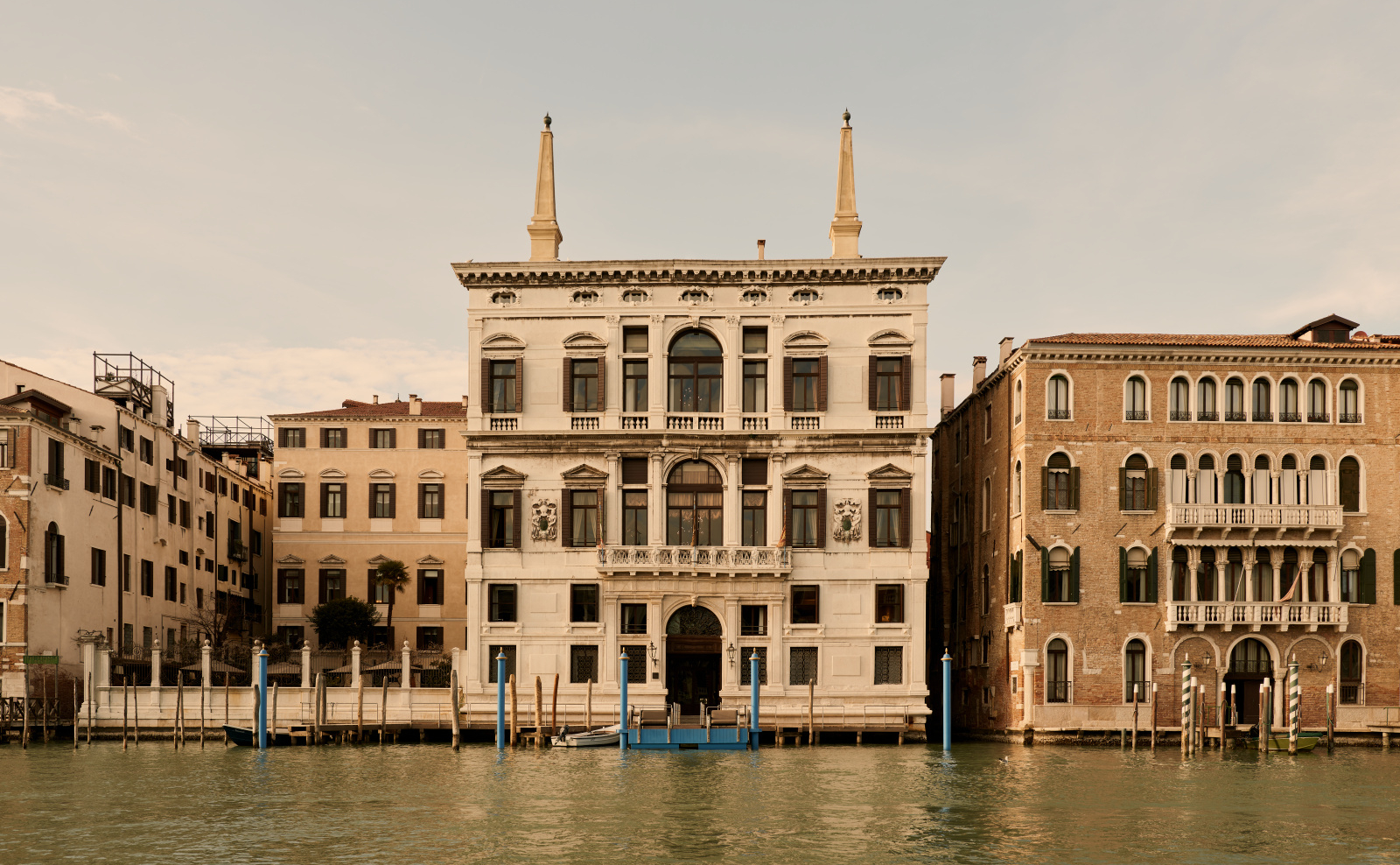 Aman Venice — Palazzo Papadopoli facade seen from across the Grand Canal at sunset