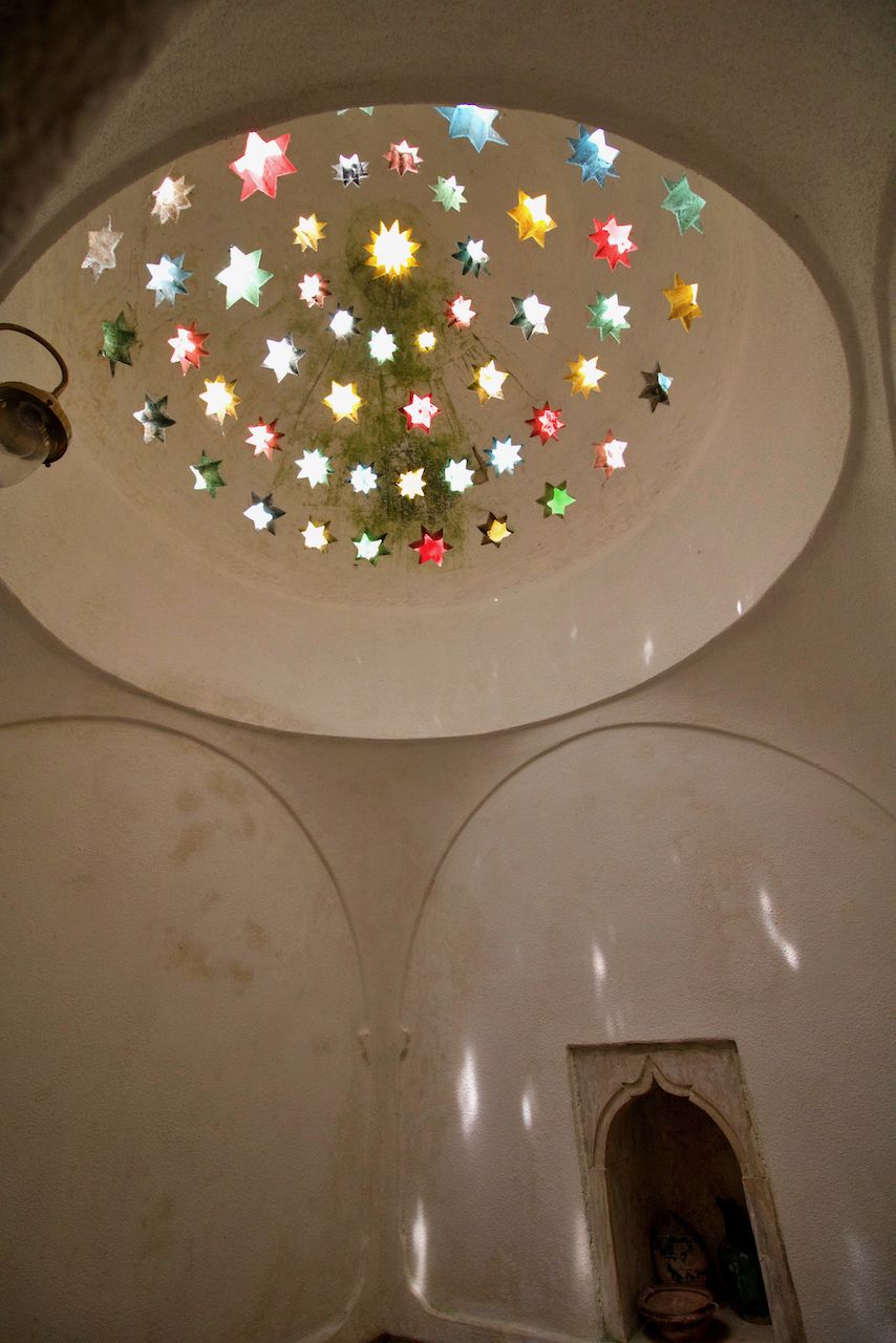 Coloured star skylights in a white domed hammam ceiling