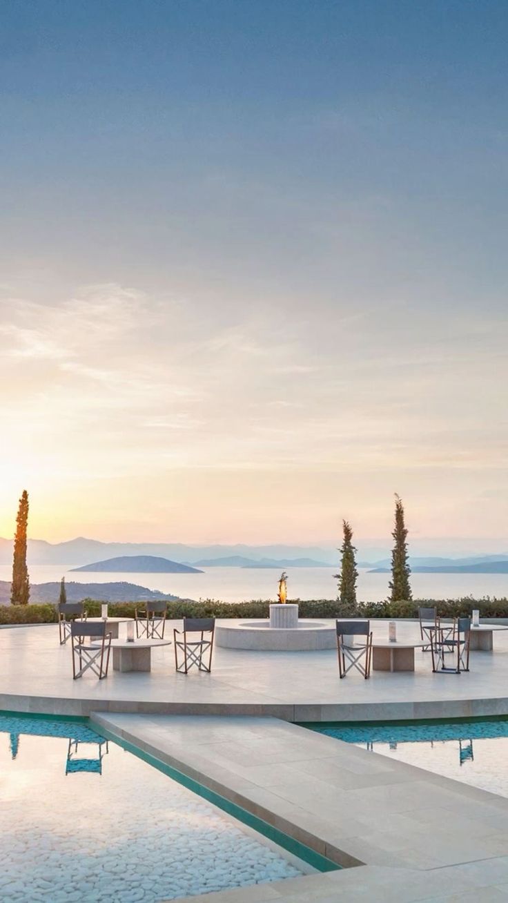 Amanzoe — sunset terrace with infinity pool, fire pit and Aegean islands, Porto Heli