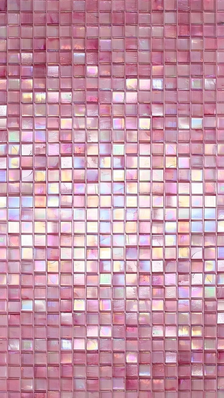 Wall of iridescent pink mosaic tiles catching the light
