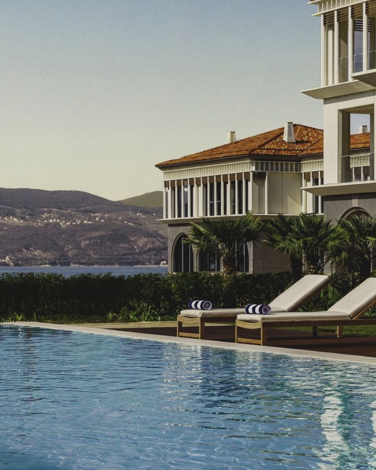 One&Only Portonovi — infinity pool overlooking Boka Bay with villa architecture and mountain backdrop