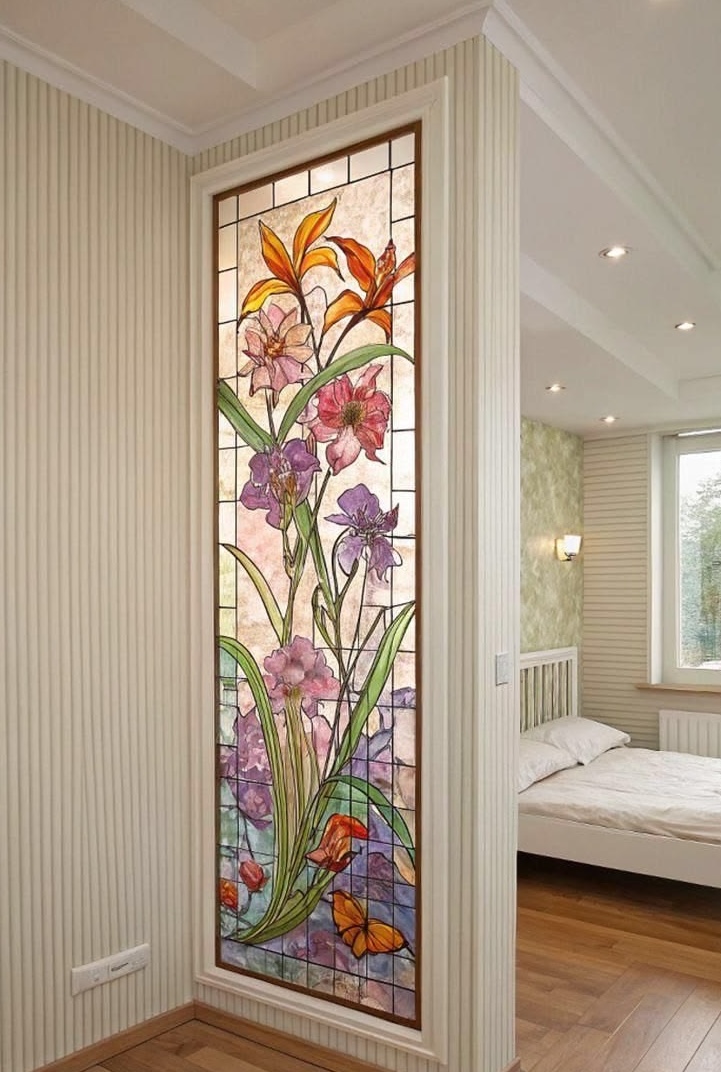 Tall stained glass panel with floral motif beside a bedroom